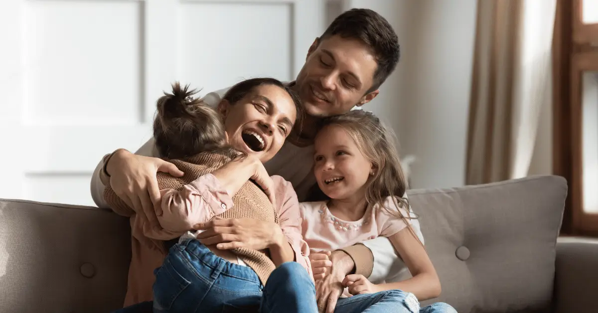 A family enjoying quality time together in the comfort of their home while receiving house cleaning services in Leawood