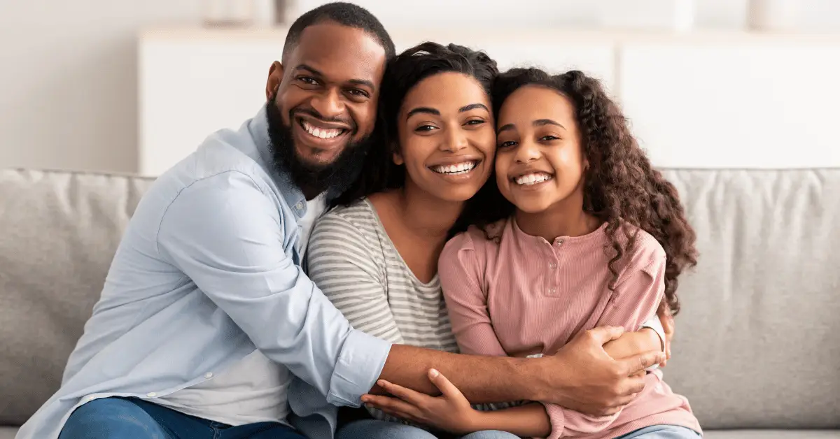 A joyful family sharing laughter and happiness in their cozy home